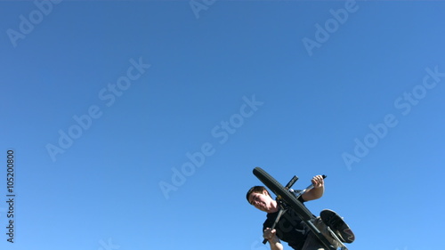 BMX rider flying into air, slow motion