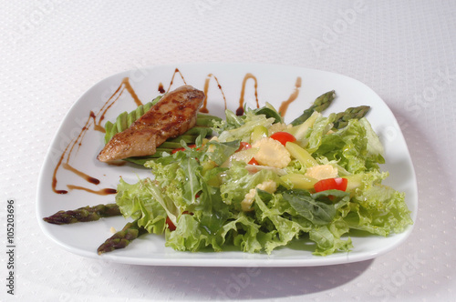 Salad with meat and lettuce on the plate