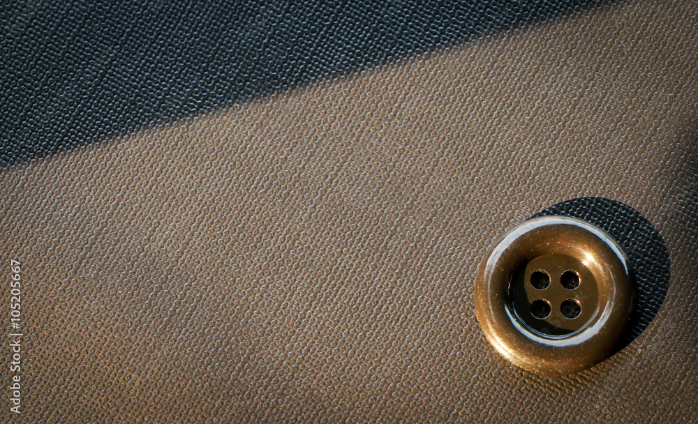 Button isolated on clothes background. Button isolated on clothes background.