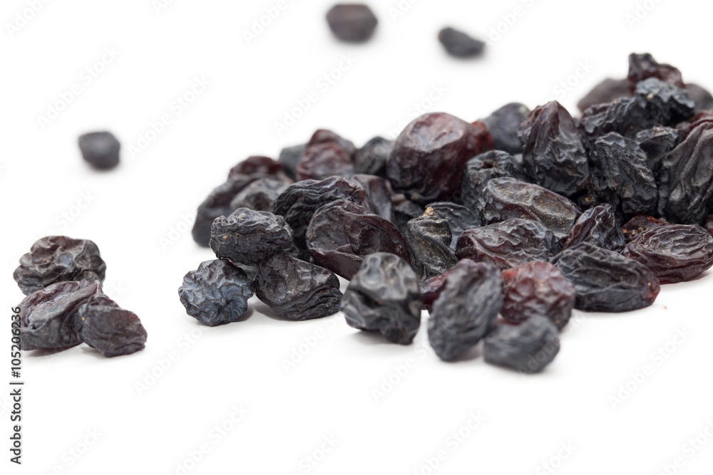Black raisins on a white background. macro Black raisins on a white background. macro