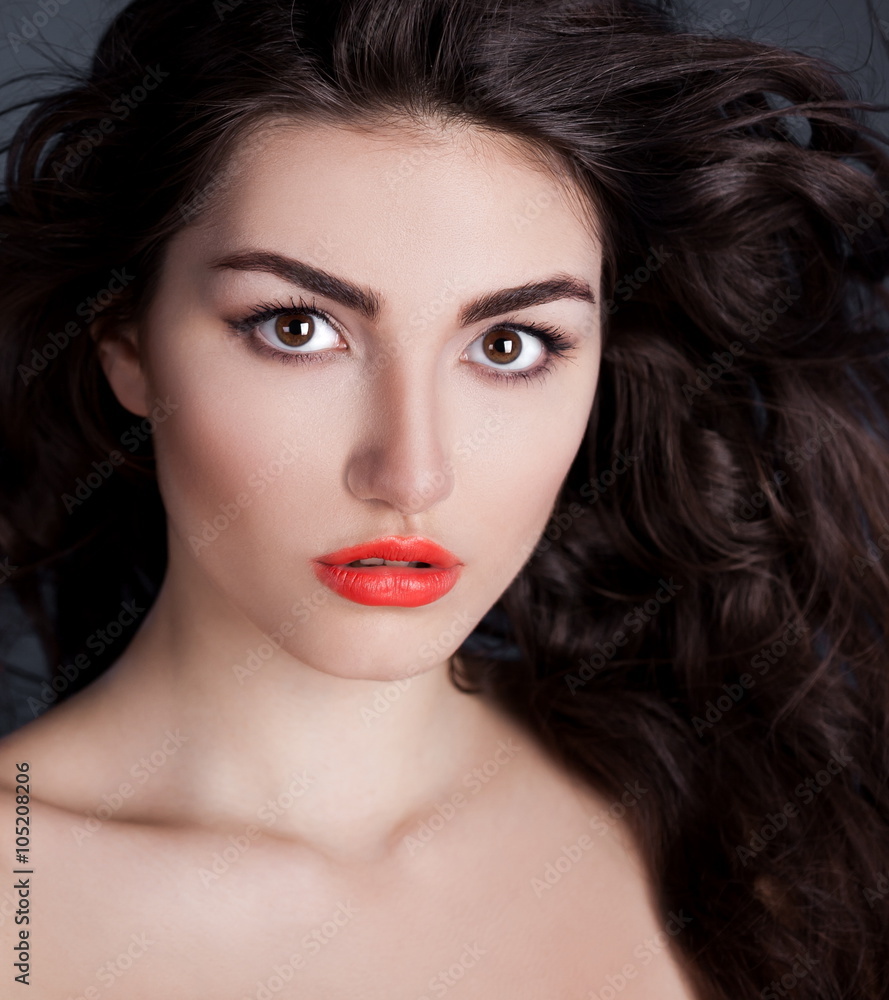 Fototapeta premium serious face with brown eyes, black background