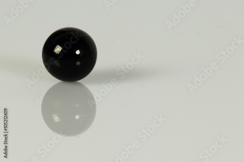 black glass marbels isolated on whit background photo