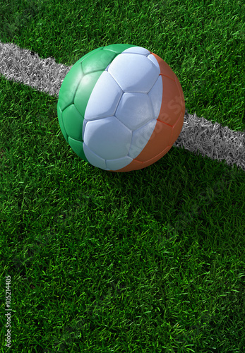Soccer ball and national flag of Ireland   green grass