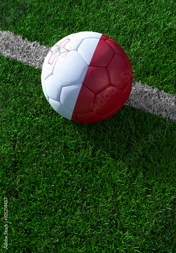 Soccer ball and national flag of Malta   green grass