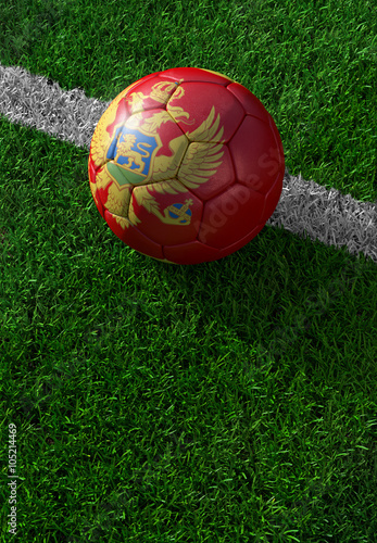 Soccer ball and national flag of Montenegro   green grass