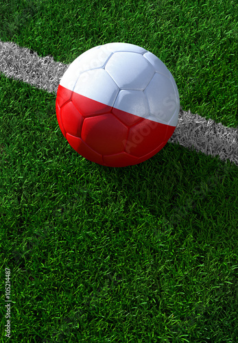 Soccer ball and national flag of Poland   green grass
