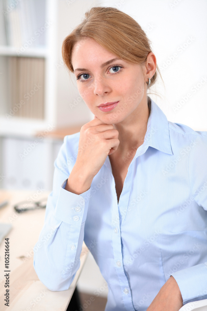 Young blonde business woman with laptop in the office. Business concept. Young blonde business woman with laptop in the office. Business concept.