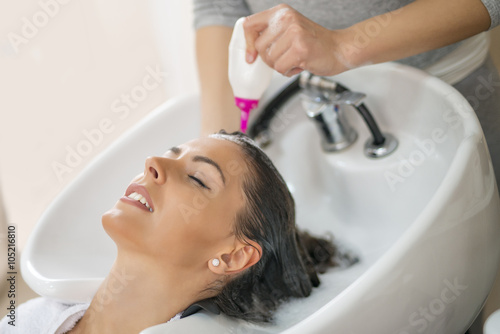 Portrait of women which wash hair in a beauty salon
