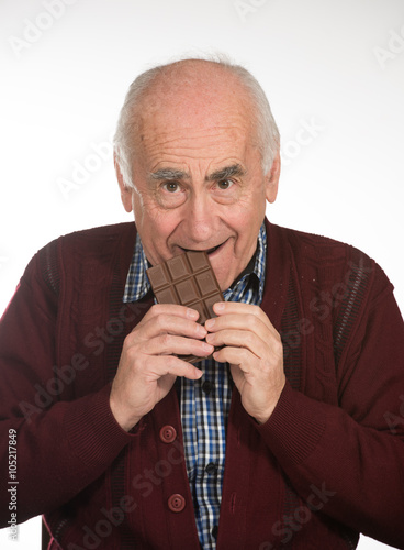 old man eating chocolate