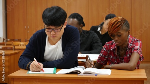 Group of Students at University Making Notes photo