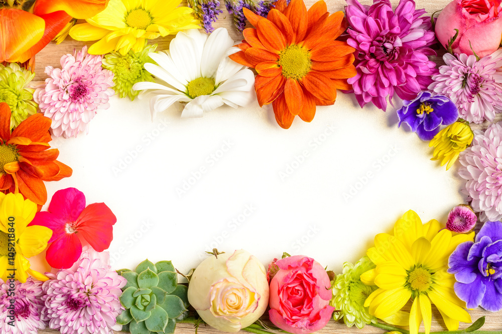 Fototapeta premium Flowers on wooden table