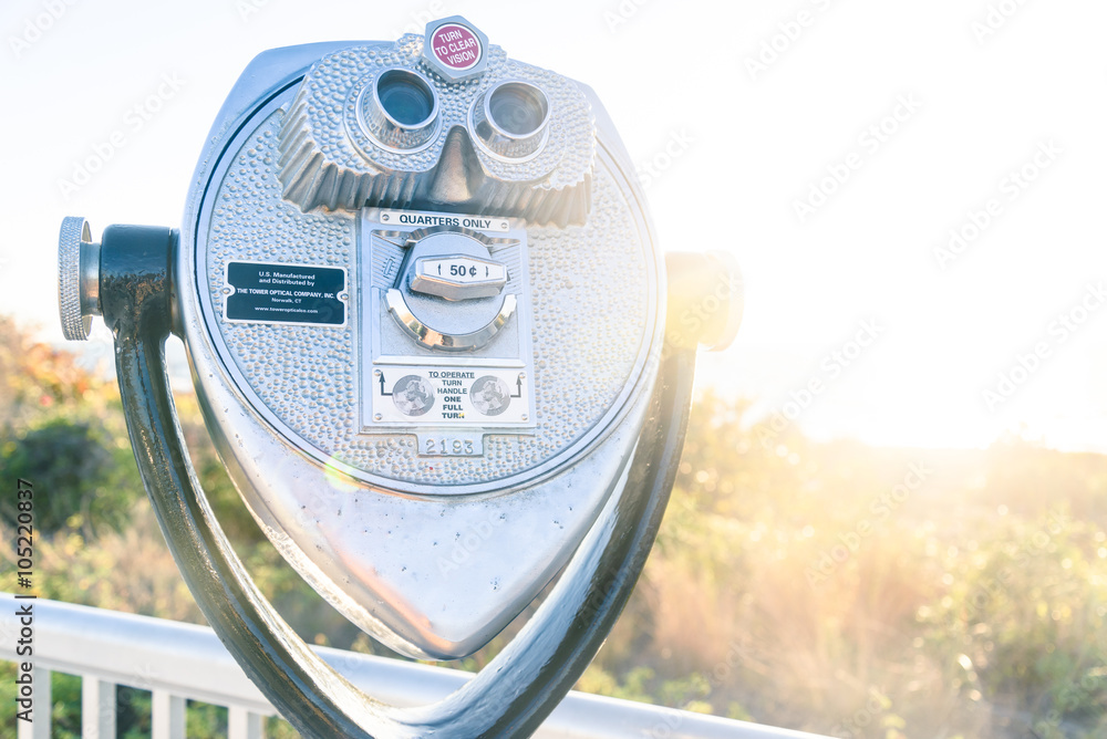 Coin Binoculars on the top over the beach view Coin Binoculars on the top over the beach view