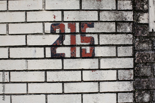 215 Number on Brick Wall