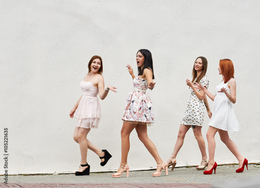 Fototapeta premium walking four young women