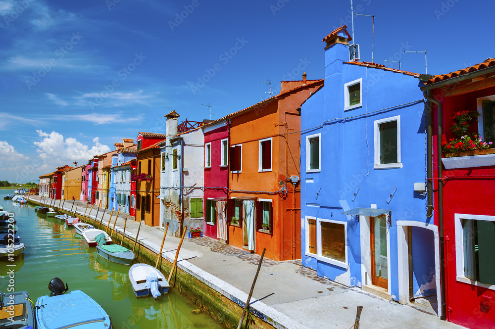 Colorful residential  house and lagoon in Burano island, Venice, Italy. 