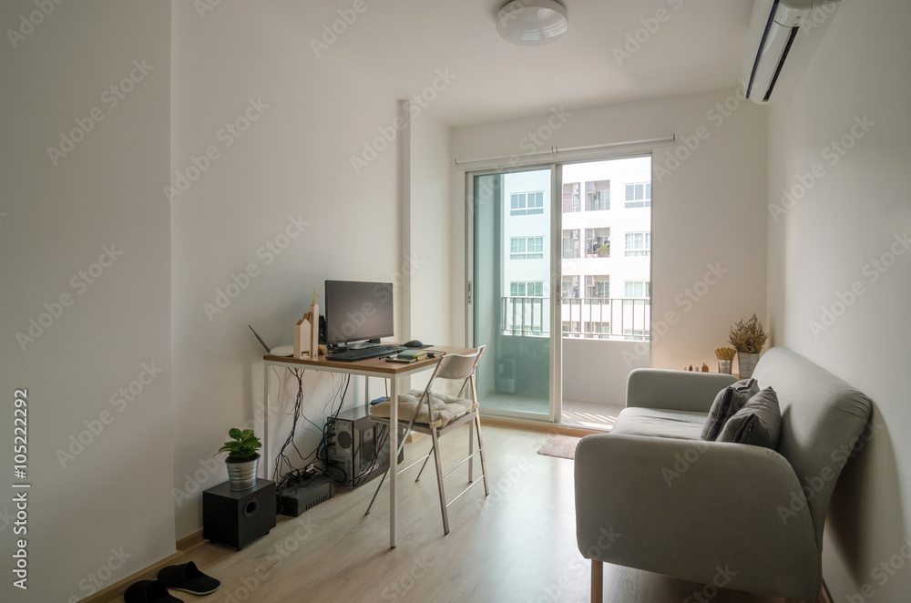 Fototapeta premium Living room with working area in apartment