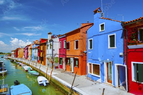 Colorful residential house and lagoon in Burano island, Venice, Italy. 