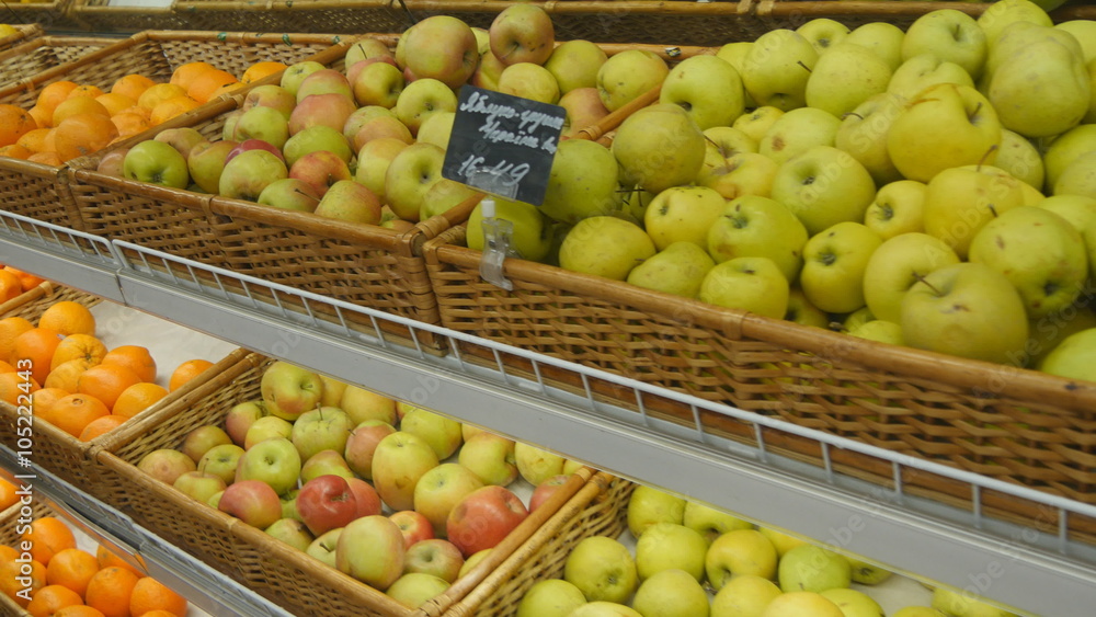 Moving past fresh fruits in a supermarket grocery. Moving past fresh fruits in a supermarket grocery.