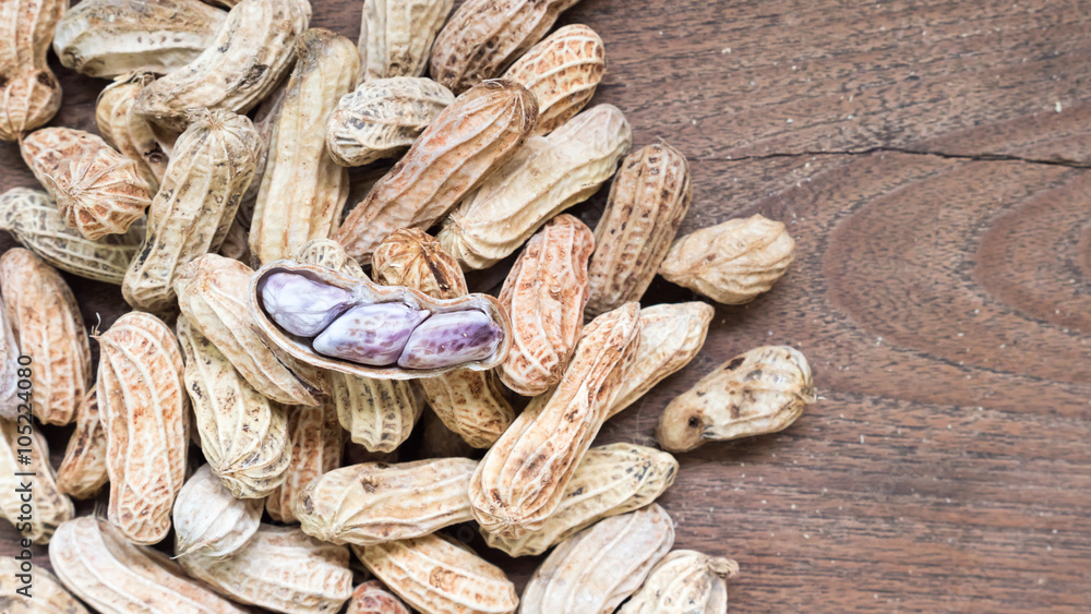 Fototapeta premium Boiled Peanuts on wooden table background.