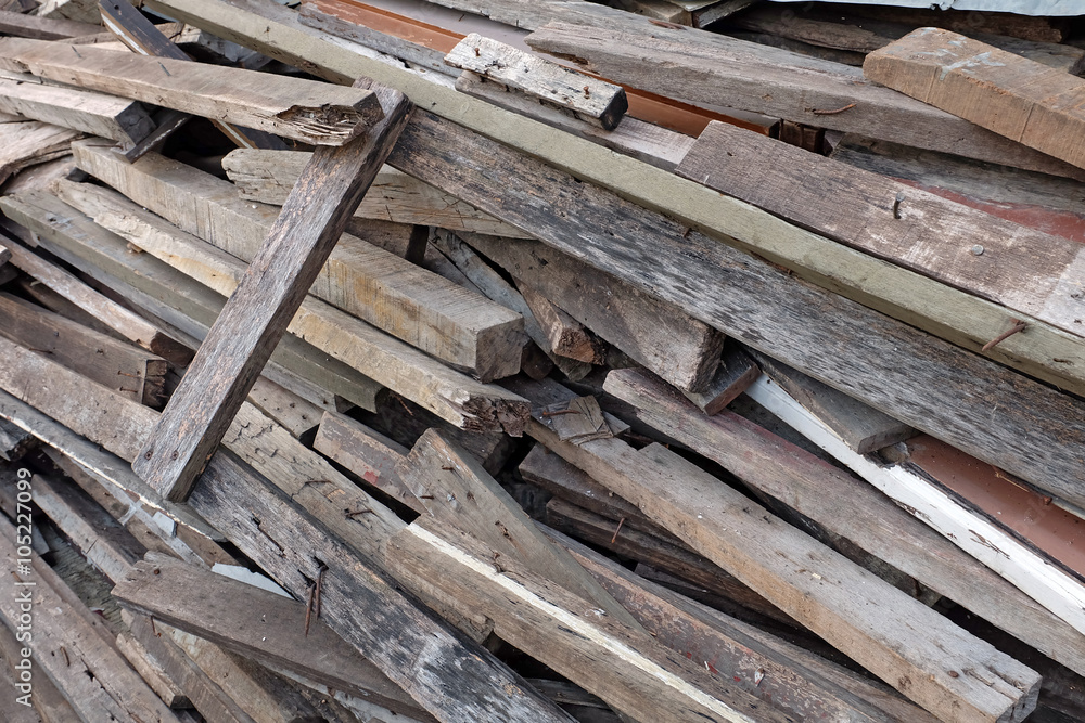 Pile of discarded lumber on plie of wood chips Pile of discarded lumber on plie of wood chips