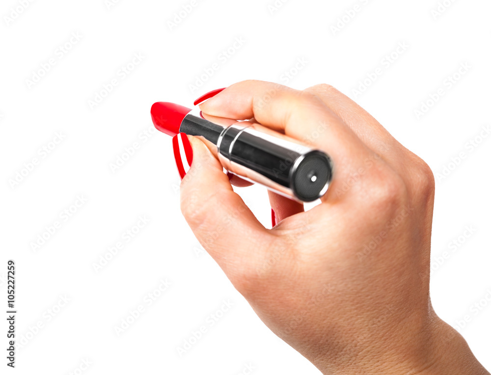 Fototapeta premium red lipstick in hand