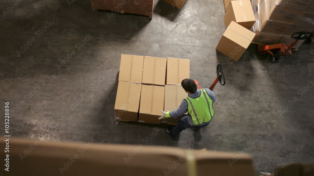Timelapse, stacking boxes in warehouse
