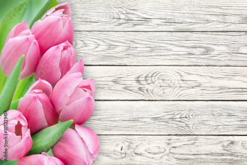 Fototapeta Naklejka Na Ścianę i Meble -  Tulips against wooden background