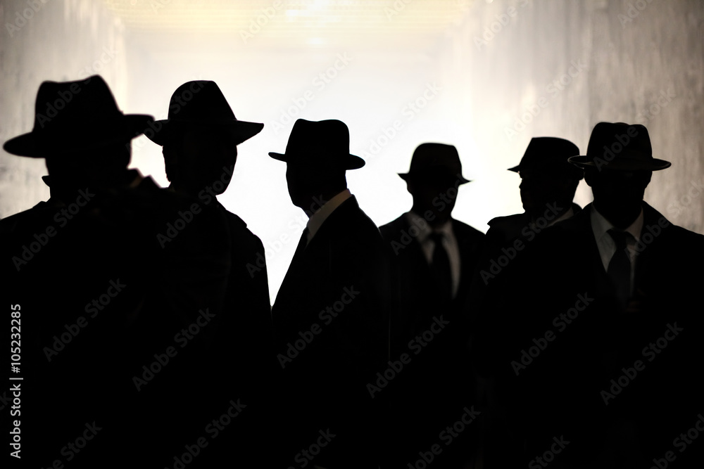 Men in fedora hats silhouette. Security, Privacy, Surveillance Concept. - obrazy, fototapety, plakaty 