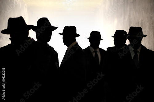 Men in fedora hats silhouette. Security, Privacy, Surveillance Concept.