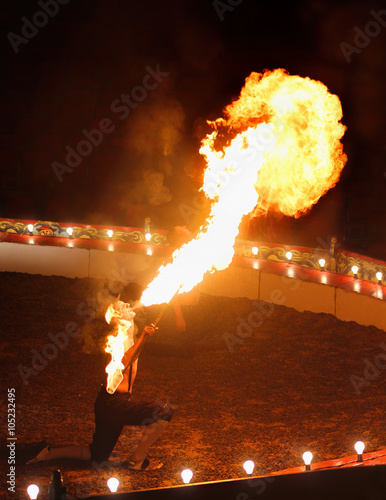Fire Breather Circus Flame Show. Large Plume Of Flame