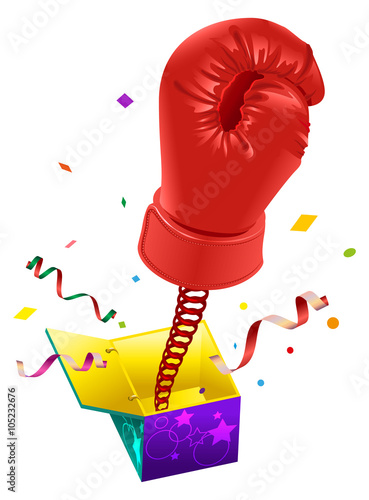 April Fools day. Red boxing glove on spring flies out of box. April Fools joke