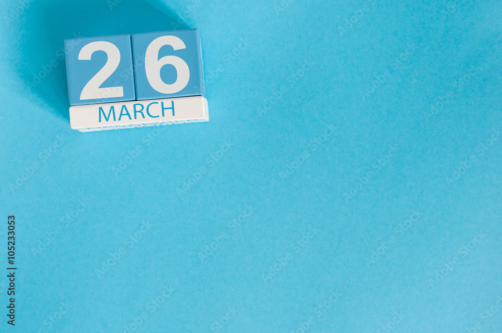 March 26th. Image of march 26 wooden color calendar on blue background