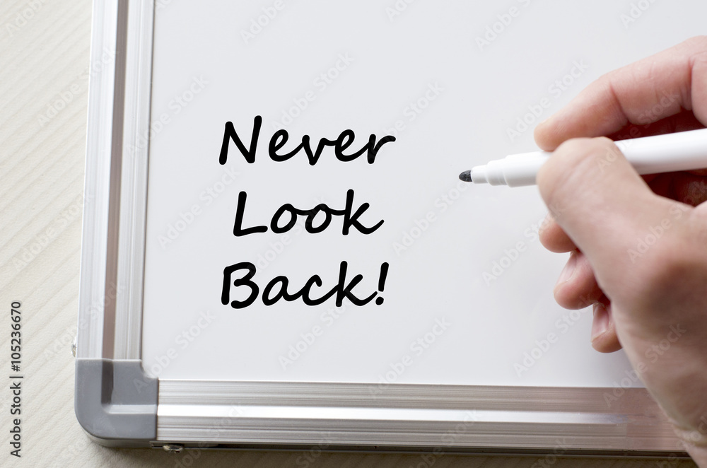 Never look back written on whiteboard Never look back written on whiteboard