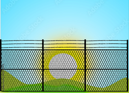 sun behind the fence 