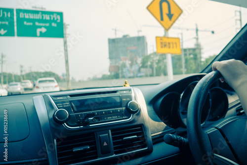 Blurred image of hands driving car