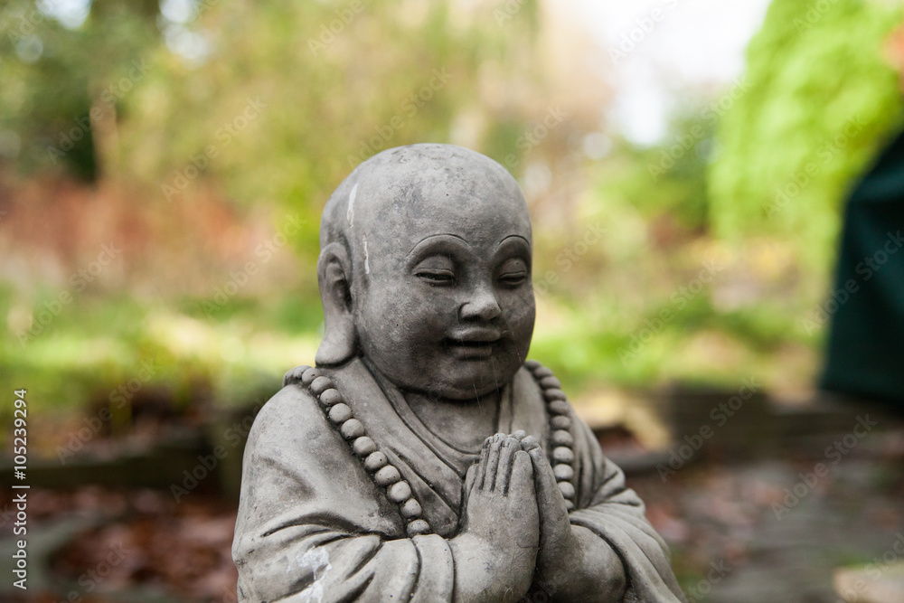 Little buddha statue parying