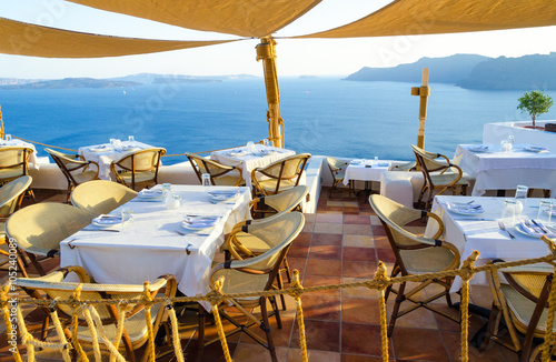 restaurant on terrace with view on sea, Santorini island, Cyclades, Greece