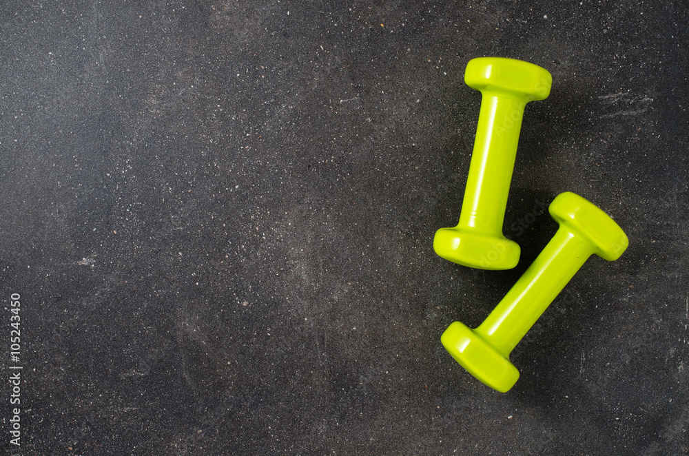 Fitness equipment on dark background Fitness equipment on dark background
