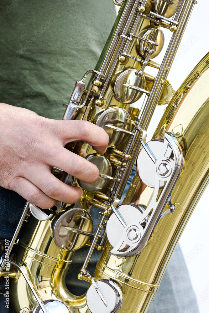 Fototapeta premium men playing saxophone closeup