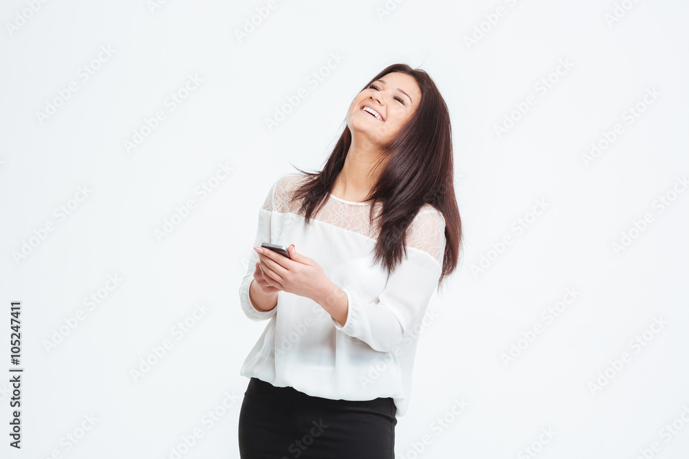 Laughing businesswoman using smartphone Laughing businesswoman using smartphone