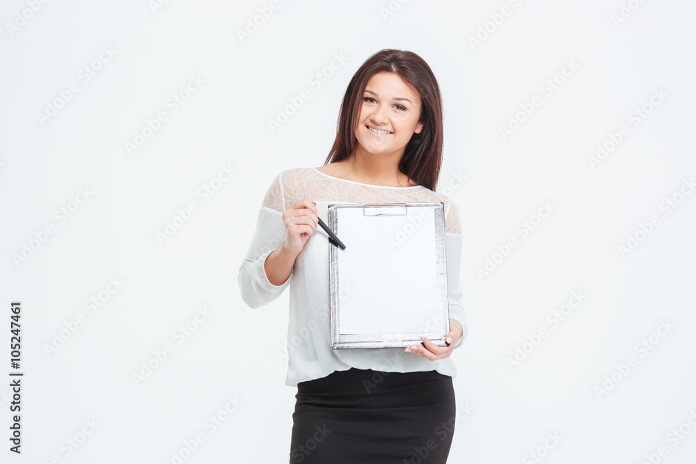 Smiling businesswoman showing blank clipboard Smiling businesswoman showing blank clipboard