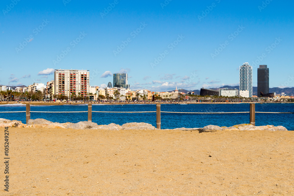 View of Barceloneta Beach and buildings in the background, Barcelona.