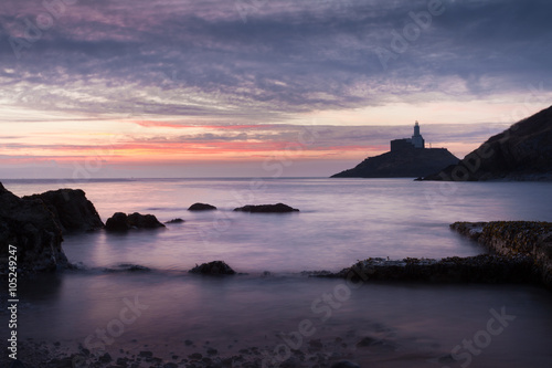 Sunrise at Mumbles Lighthouse  Early morning at Mumbles lighthouse in Swansea Bay  South Wales