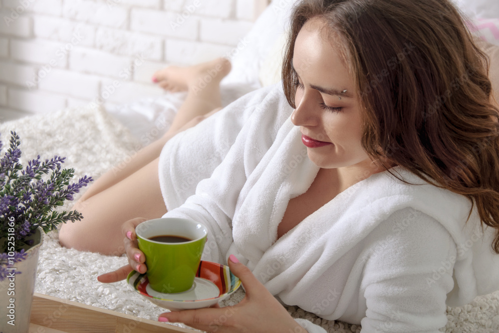 Girl woke up in the morning and drink coffee. Girl woke up in the morning and drink coffee.