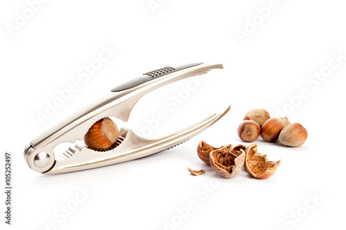 Nutcracker with hazelnut isolated on white