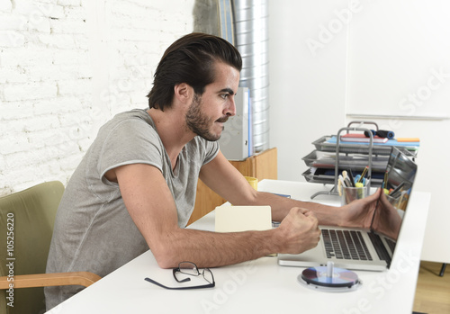 modern hipster style student or businessman working in stress with laptop at home office angry upset