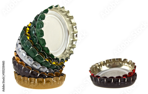 Colored beer bottle caps isolated on white background