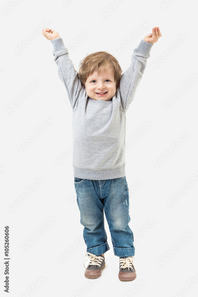 Boy playing welcomes his hands up. Grey sweater and blue jeans. Mockups template Boy playing welcomes his hands up. Grey sweater and blue jeans. Mockups template