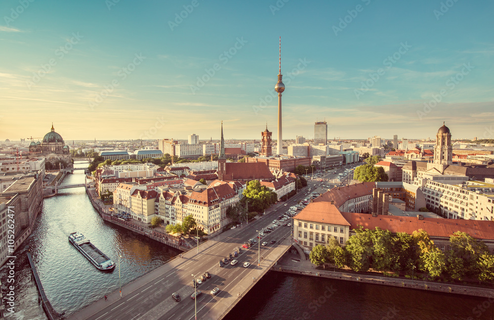 Berlin skyline with Spree river at sunset with retro vintage filter effect, Germany