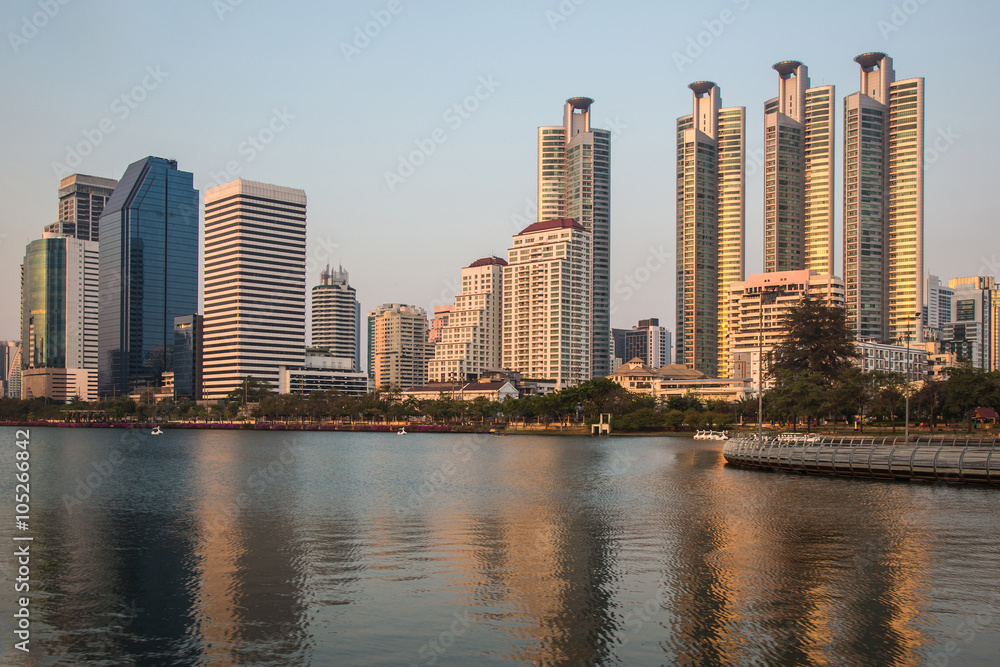 Naklejka premium City, urban and lake at evening time.